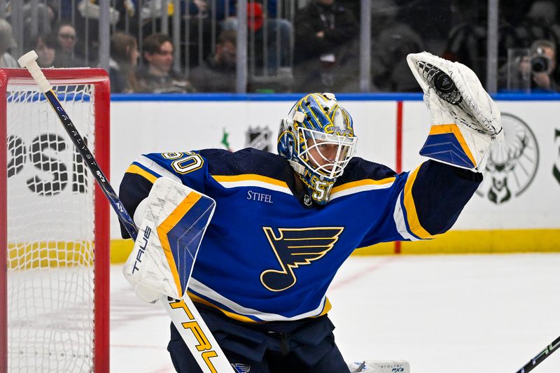 Dec 14, 2023; St. Louis, Missouri, USA;  St. Louis Blues goaltender Jordan Binnington (50) makes a save against the Ottawa Senators during the third period at Enterprise Center. Mandatory Credit: Jeff Curry-USA TODAY Sports