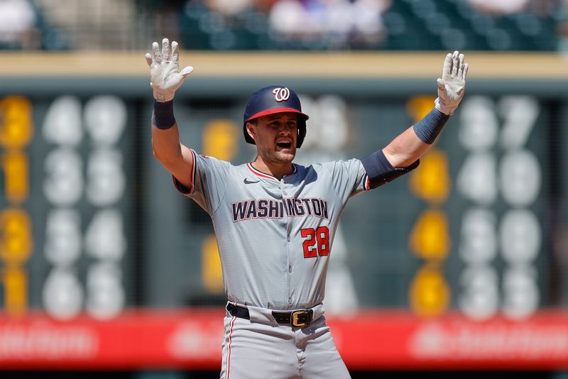 Jun 23, 2024; Denver, Colorado, USA; Washington Nationals right fielder Lane Thomas (28) reacts from second on an RBI double in the ninth inning against the Colorado Rockies at Coors Field. Mandatory Credit: Isaiah J. Downing-USA TODAY Sports