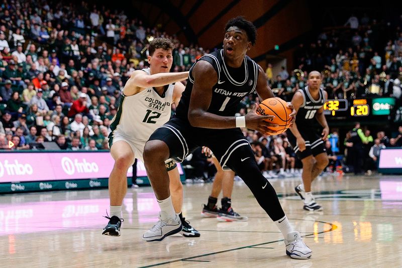 Feb 17, 2024; Fort Collins, Colorado, USA; Utah State Aggies forward Great Osobor (1) controls the ball against Colorado State Rams forward Patrick Cartier (12) in the first half at Moby Arena. Mandatory Credit: Isaiah J. Downing-USA TODAY Sports