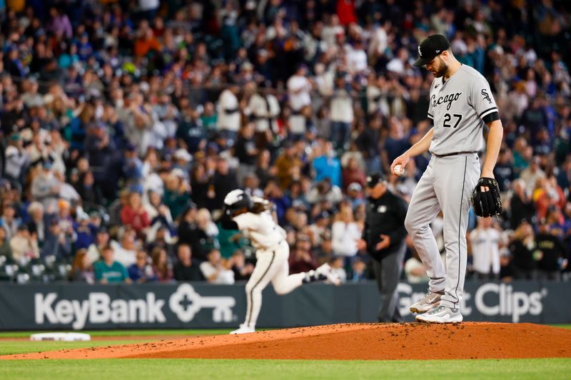 Jun 17, 2023; Seattle, Washington, USA; Chicago White Sox starting pitcher Lucas Giolito (27) stands on the mound after surrendering a solo-home run to Seattle Mariners shortstop J.P. Crawford (background) during the first inning at T-Mobile Park. Mandatory Credit: Joe Nicholson-USA TODAY Sports