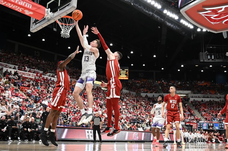 Mar 7, 2024; Pullman, Washington, USA; Washington Huskies forward Moses Wood (13) shoots the ball against Washington State Cougars forward Andrej Jakimovski (23) in the second half at Friel Court at Beasley Coliseum. Washington Huskies won 74-68. Mandatory Credit: James Snook-USA TODAY Sports