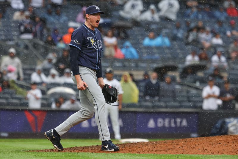 May 4, 2025; Bronx, New York, USA; Tampa Bay Rays relief pitcher Pete Fairbanks (29) reacts after striking out the side to close the ninth inning against the New York Yankees at Yankee Stadium. Mandatory Credit: Vincent Carchietta-Imagn Images