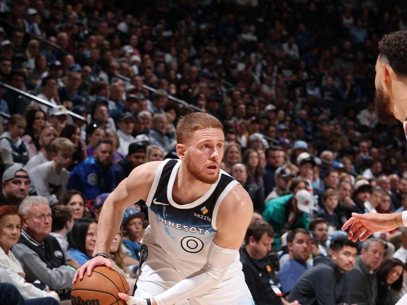 MINNEAPOLIS, MN - NOVEMBER 17: Donte DiVincenzo #0 of the Minnesota Timberwolves looks on during the game against the Phoenix Suns on November 17, 2024 at Target Center in Minneapolis, Minnesota. NOTE TO USER: User expressly acknowledges and agrees that, by downloading and or using this Photograph, user is consenting to the terms and conditions of the Getty Images License Agreement. Mandatory Copyright Notice: Copyright 2024 NBAE(Photo by David Sherman/NBAE via Getty Images)