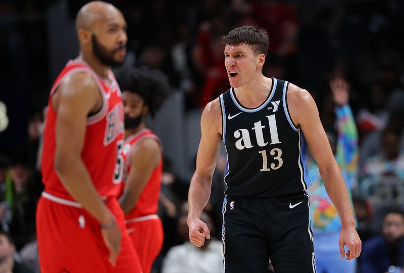 ATLANTA, GEORGIA - FEBRUARY 12:  Bogdan Bogdanovic #13 of the Atlanta Hawks reacts after hitting a three-point basket against the Chicago Bulls during the fourth quarter at State Farm Arena on February 12, 2024 in Atlanta, Georgia.  NOTE TO USER: User expressly acknowledges and agrees that, by downloading and/or using this photograph, user is consenting to the terms and conditions of the Getty Images License Agreement.  (Photo by Kevin C. Cox/Getty Images)