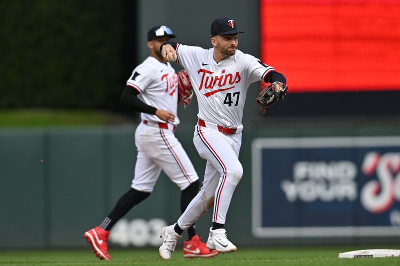 May 4, 2024; Minneapolis, Minnesota, USA; Minnesota Twins second base Edouard Julien (47) makes a putout during the ninth inning against the Boston Red Sox at Target Field. Mandatory Credit: Jeffrey Becker-USA TODAY Sports