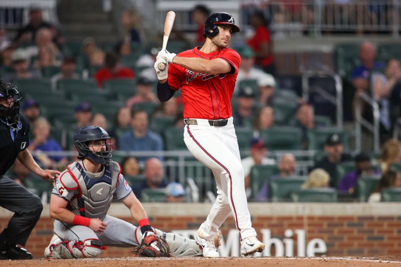 Apr 26, 2024; Atlanta, Georgia, USA; Atlanta Braves first baseman Matt Olson (28) hits a RBI single against the Cleveland Guardians in the fifth inning at Truist Park. Mandatory Credit: Brett Davis-USA TODAY Sports
