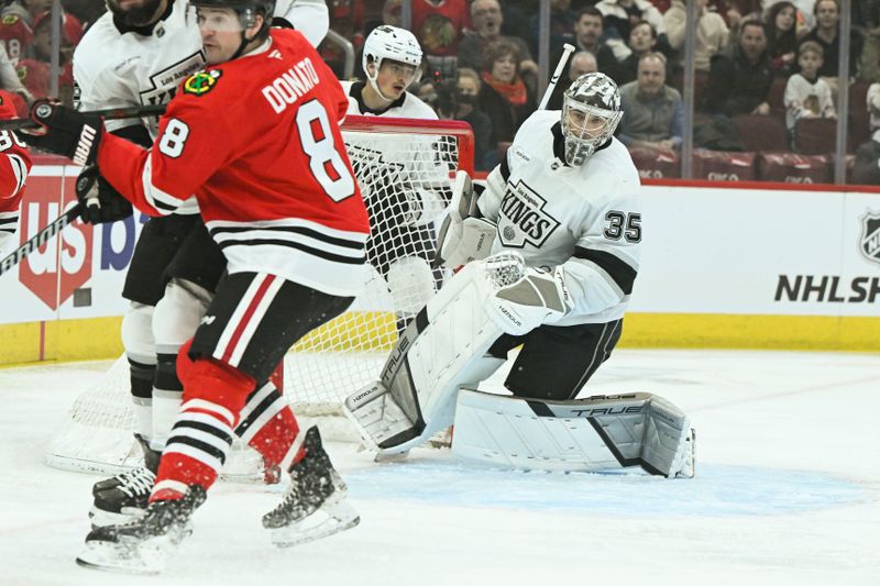 Mar 3, 2025; Chicago, Illinois, USA;  Los Angeles Kings goaltender Darcy Kuemper (35) defends against Chicago Blackhawks center Ryan Donato (8) during the first period at the United Center. Mandatory Credit: Matt Marton-Imagn Images