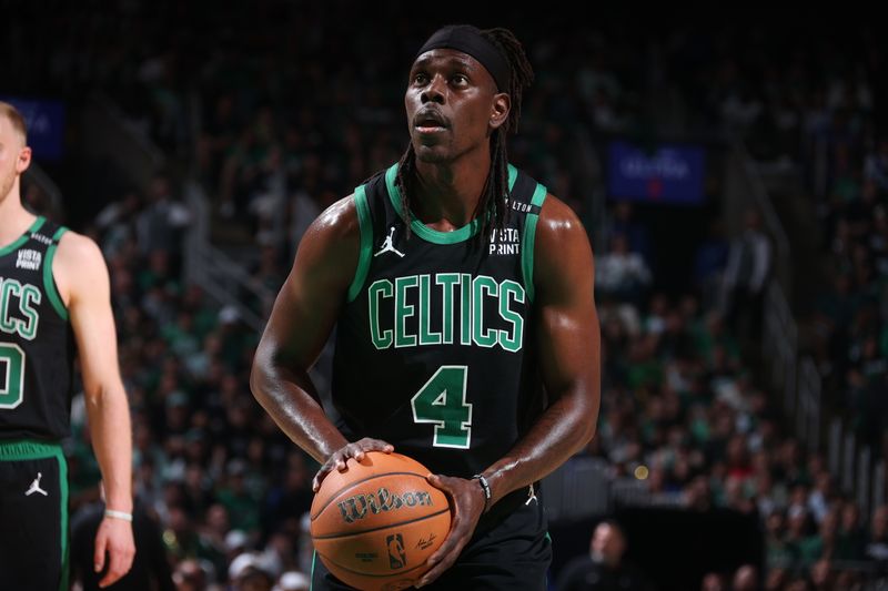 BOSTON, MA - JUNE 9: Jrue Holiday #4 of the Boston Celtics shoots a free throw during the game against the Dallas Mavericks during Game 1 of the 2024 NBA Finals on June 9, 2024 at the TD Garden in Boston, Massachusetts. NOTE TO USER: User expressly acknowledges and agrees that, by downloading and or using this photograph, User is consenting to the terms and conditions of the Getty Images License Agreement. Mandatory Copyright Notice: Copyright 2024 NBAE  (Photo by Nathaniel S. Butler/NBAE via Getty Images)