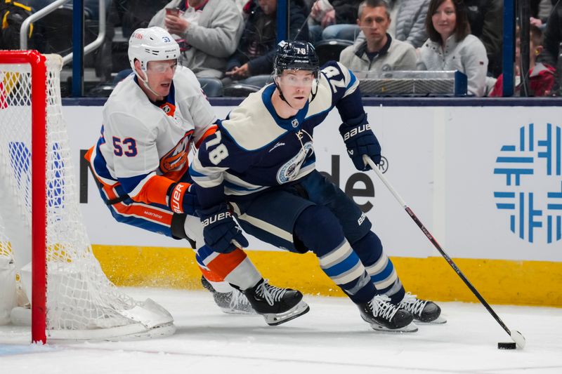 Apr 4, 2024; Columbus, Ohio, USA;  Columbus Blue Jackets defenseman Damon Severson (78) skates against New York Islanders center Casey Cizikas (53) with the puck in the second period at Nationwide Arena. Mandatory Credit: Aaron Doster-USA TODAY Sports