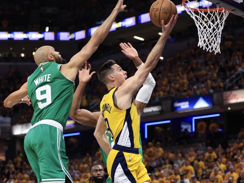 INDIANAPOLIS, INDIANA - MAY 27: Derrick White #9 of the Boston Celtics blocks T.J. McConnell #9 of the Indiana Pacers during the third quarter in Game Four of the Eastern Conference Finals at Gainbridge Fieldhouse on May 27, 2024 in Indianapolis, Indiana. NOTE TO USER: User expressly acknowledges and agrees that, by downloading and or using this photograph, User is consenting to the terms and conditions of the Getty Images License Agreement. (Photo by Justin Casterline/Getty Images)