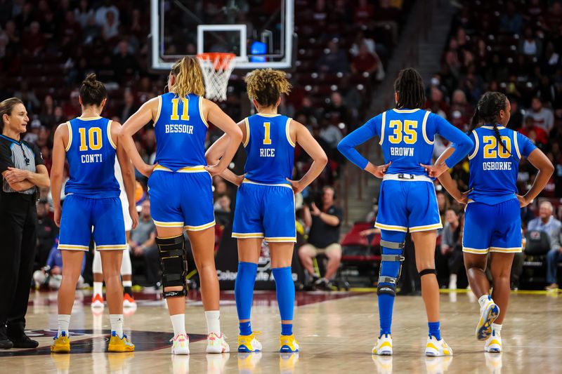 Nov 29, 2022; Columbia, South Carolina, USA; UCLA Bruins players watch a South Carolina Gamecocks player make a technical free throw in the second half at Colonial Life Arena. Mandatory Credit: Jeff Blake-USA TODAY Sports