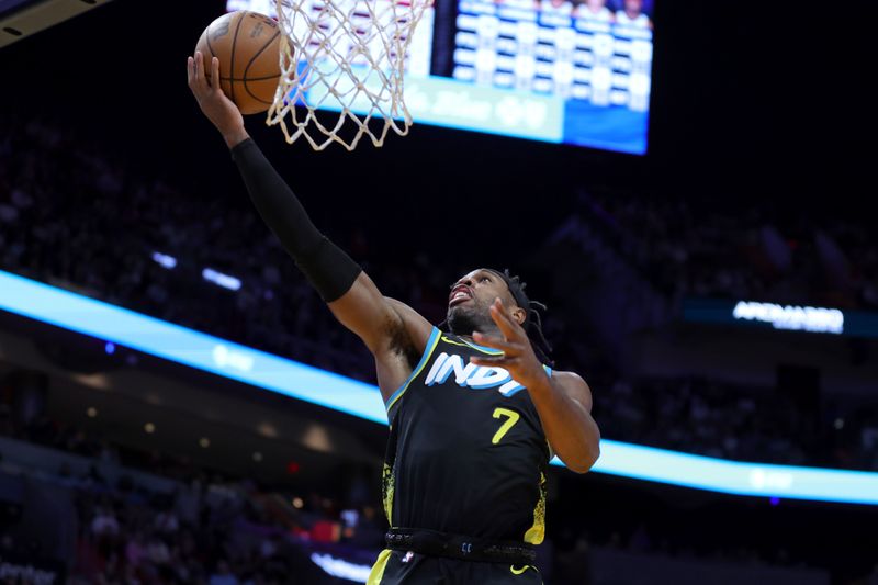 MIAMI, FLORIDA - DECEMBER 02: Buddy Hield #7 of the Indiana Pacers drives to the basket against the Miami Heat during the third quarter of the game at Kaseya Center on December 02, 2023 in Miami, Florida. NOTE TO USER: User expressly acknowledges and agrees that, by downloading and or using this photograph, User is consenting to the terms and conditions of the Getty Images License Agreement. (Photo by Megan Briggs/Getty Images)