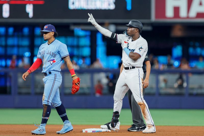 Jun 21, 2023; Miami, Florida, USA; Miami Marlins right fielder Jesus Sanchez (7) reacts from second base after hitting a double against the Toronto Blue Jays during the fourth inning at loanDepot Park. Mandatory Credit: Sam Navarro-USA TODAY Sports