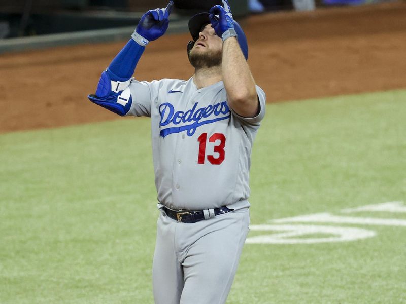 Jul 23, 2023; Arlington, Texas, USA;  Los Angeles Dodgers third baseman Max Muncy (13) celebrates after hitting a grand slam during the first inning against the Texas Rangers at Globe Life Field. Mandatory Credit: Kevin Jairaj-USA TODAY Sports