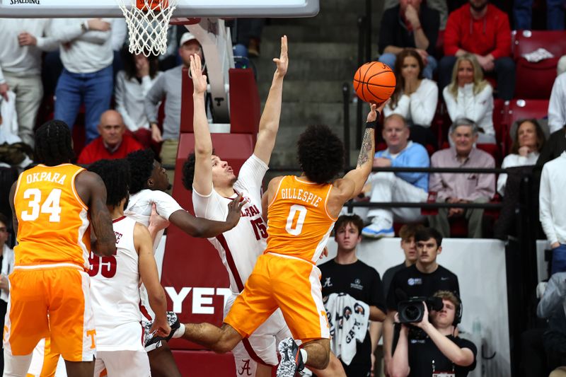 Jan 24, 2026; Tuscaloosa, Alabama, USA; Tennessee Volunteers guard Ja'Kobi Gillespie (0) shoots over Alabama Crimson Tide center Noah Williamson (15) during the second half at Coleman Coliseum. Mandatory Credit: David Leong-Imagn Images