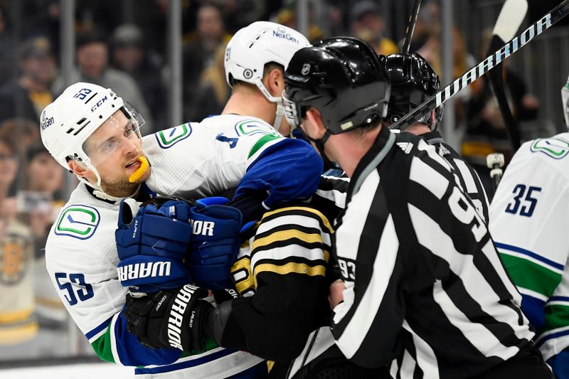 Feb 8, 2024; Boston, Massachusetts, USA; Vancouver Canucks center Teddy Blueger (53) grabs the head of Boston Bruins center Jakub Lauko (94) during the third period at TD Garden. Mandatory Credit: Bob DeChiara-USA TODAY Sports