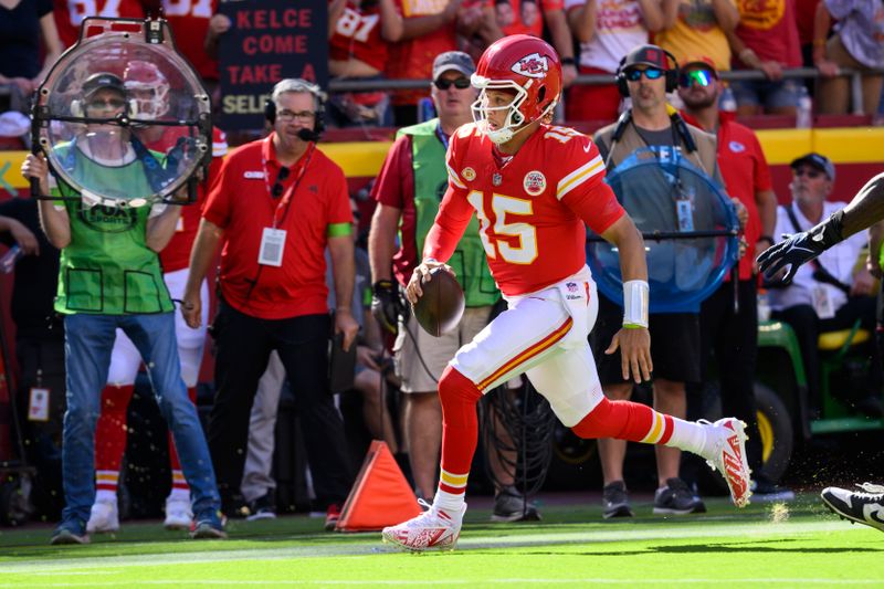 Kansas City Chiefs quarterback Patrick Mahomes runs the ball against the Chicago Bears during the first half of an NFL football game, Sunday, Sept. 24, 2023 in Kansas City, Mo. (AP Photo/Reed Hoffmann)