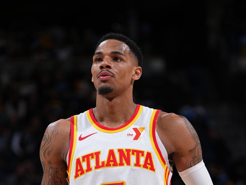 DENVER, CO - APRIL 6: Dejounte Murray #5 of the Atlanta Hawks shoots a free throw during the game against the Denver Nuggets on April 6, 2024 at the Ball Arena in Denver, Colorado. NOTE TO USER: User expressly acknowledges and agrees that, by downloading and/or using this Photograph, user is consenting to the terms and conditions of the Getty Images License Agreement. Mandatory Copyright Notice: Copyright 2024 NBAE (Photo by Garrett Ellwood/NBAE via Getty Images)