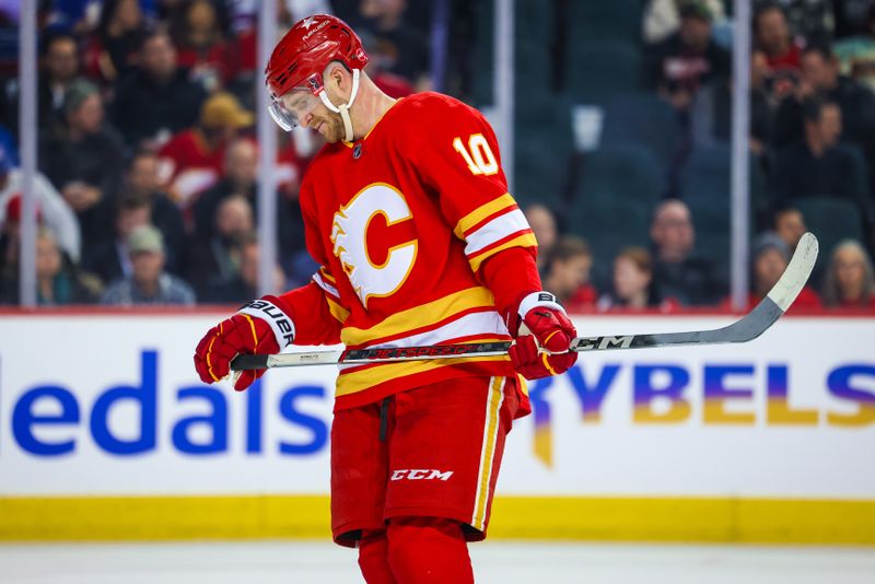 Oct 24, 2023; Calgary, Alberta, CAN; Calgary Flames center Jonathan Huberdeau (10) reacts during the third period against the New York Rangers at Scotiabank Saddledome. Mandatory Credit: Sergei Belski-USA TODAY Sports