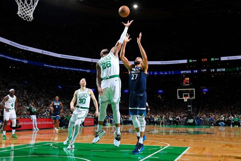 BOSTON, MA - NOVEMBER 24: Xavier Tillman #26 of the Boston Celtics rebounds during the game against the Minnesota Timberwolves on November 24, 2024 at the TD Garden in Boston, Massachusetts. NOTE TO USER: User expressly acknowledges and agrees that, by downloading and or using this photograph, User is consenting to the terms and conditions of the Getty Images License Agreement. Mandatory Copyright Notice: Copyright 2024 NBAE(Photo by Brian Babineau/NBAE via Getty Images)