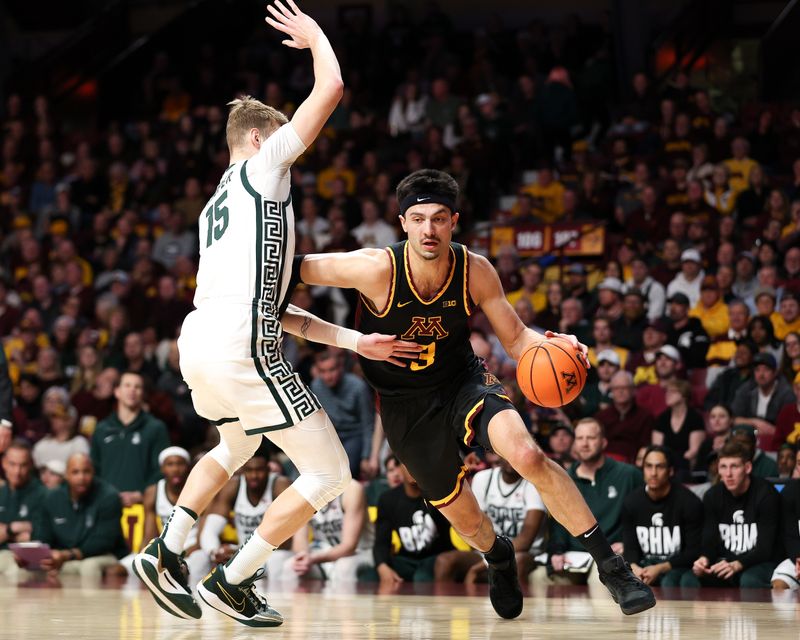 Feb 6, 2024; Minneapolis, Minnesota, USA; Minnesota Golden Gophers forward Dawson Garcia (3) works around Michigan State Spartans center Carson Cooper (15) during the first half at Williams Arena. Mandatory Credit: Matt Krohn-USA TODAY Sports