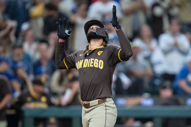 Sep 10, 2024; Seattle, Washington, USA;  San Diego Padres right fielder Fernando Tatis Jr. (23) celebrates while rounding the bases after hitting a three-run home runduring the third inning against the Seattle Mariners at T-Mobile Park. Mandatory Credit: Stephen Brashear-Imagn Images