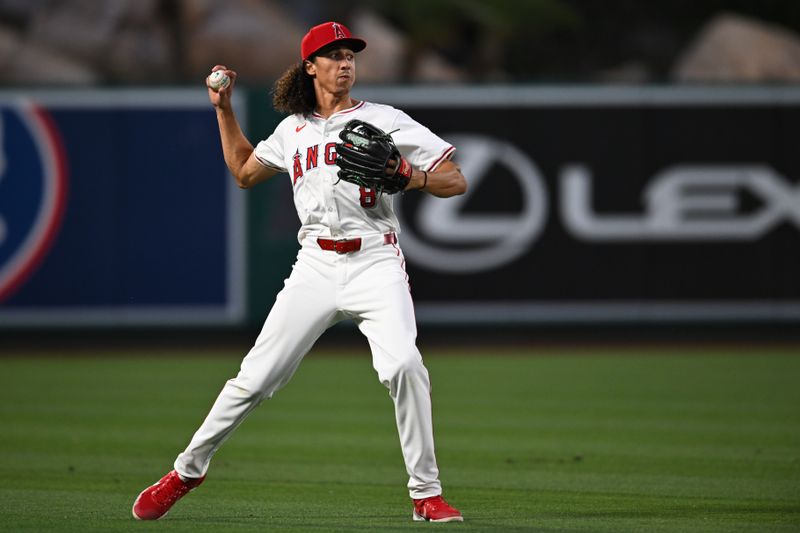 May 11, 2024; Anaheim, California, USA; Los Angeles Angels outfielder Cole Tucker (8) fields the ball against the Kansas City Royals during the sixth inning at Angel Stadium. Mandatory Credit: Jonathan Hui-USA TODAY Sports