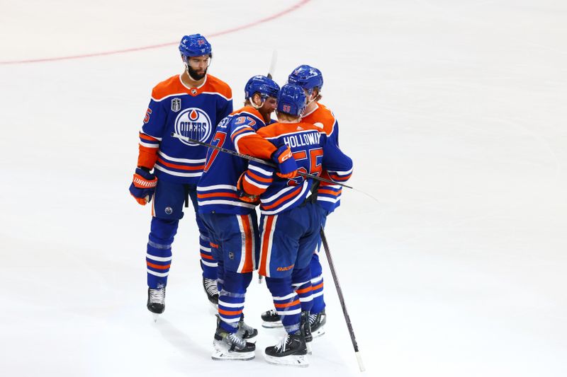 Jun 15, 2024; Edmonton, Alberta, CAN; Edmonton Oilers left wing Dylan Holloway (55) celebrates goal with teammates in the third period against the Florida Panthers  in game four of the 2024 Stanley Cup Final at Rogers Place. Mandatory Credit: Sergei Belski-USA TODAY Sports