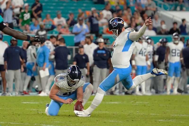 Tennessee Titans place kicker Nick Folk (6) kicks the extra point during the second half of an NFL football game against the Miami Dolphins, Monday, Sept. 30, 2024, in Miami Gardens, Fla. (AP Photo/Rebecca Blackwell)