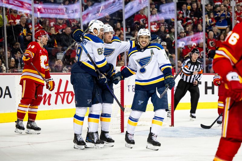 Dec 5, 2024; Calgary, Alberta, CAN; St. Louis Blues left wing Pavel Buchnevich (89) celebrates a goal with left wing Jake Neighbours (63) and center Robert Thomas (18) against the Calgary Flames during the third period at Scotiabank Saddledome. Mandatory Credit: Brett Holmes-Imagn Images