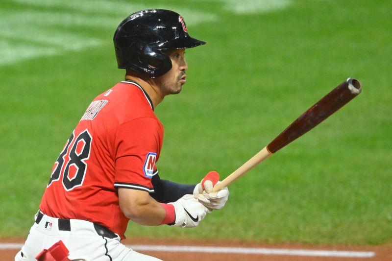 Sep 11, 2025; Cleveland, Ohio, USA; Cleveland Guardians left fielder Steven Kwan (38) doubles in the fourth inning against the Kansas City Royals at Progressive Field. Mandatory Credit: David Richard-Imagn Images