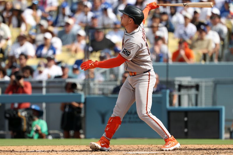 Sep 21, 2025; Los Angeles, California, USA;  San Francisco Giants catcher Patrick Bailey (14) hits an RBI ground-rule double during the eighth inning against the Los Angeles Dodgers at Dodger Stadium. Mandatory Credit: Kiyoshi Mio-Imagn Images