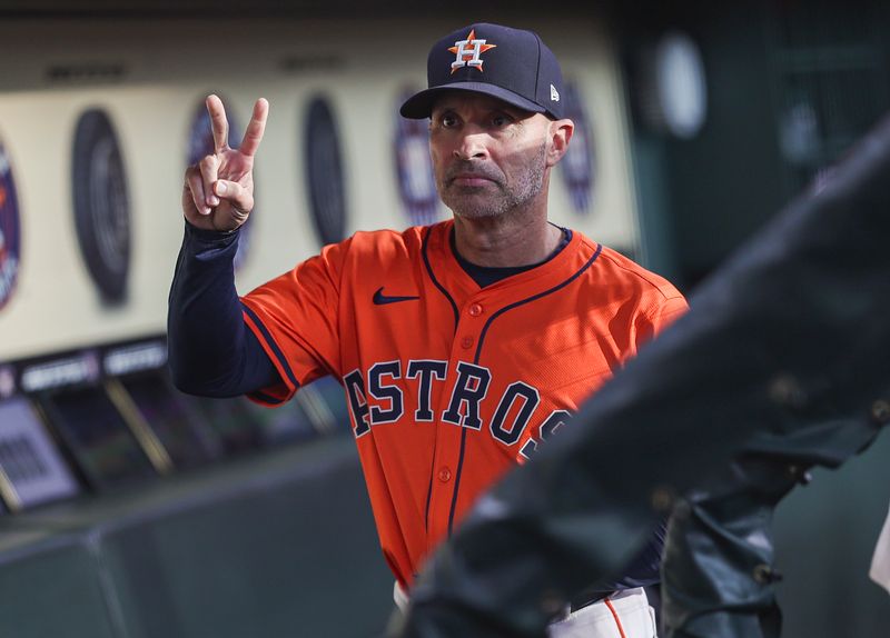 May 3, 2024; Houston, Texas, USA; Houston Astros manager Joe Espada (19) in the dugout before the game against the Seattle Mariners at Minute Maid Park. Mandatory Credit: Troy Taormina-USA TODAY Sports