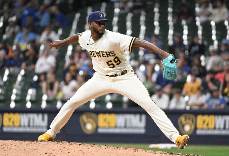 May 23, 2023; Milwaukee, Wisconsin, USA; Milwaukee Brewers relief pitcher Elvis Peguero (59) delivers a pitch against the Houston Astros in the seventh inning at American Family Field. Mandatory Credit: Michael McLoone-USA TODAY Sports