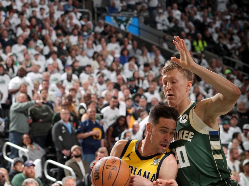 MILWAUKEE, WI - APRIL 23: T.J. McConnell #9 of the Indiana Pacers drives to the basket during the game against the Milwaukee Bucks during Round One Game Two of the 2024 NBA Playoffs on April 23, 2024 at the Fiserv Forum Center in Milwaukee, Wisconsin. NOTE TO USER: User expressly acknowledges and agrees that, by downloading and or using this Photograph, user is consenting to the terms and conditions of the Getty Images License Agreement. Mandatory Copyright Notice: Copyright 2024 NBAE (Photo by Gary Dineen/NBAE via Getty Images).