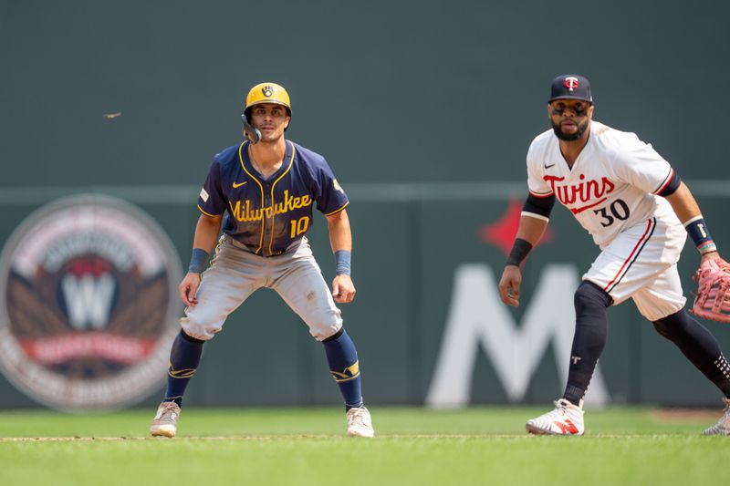 Jul 21, 2024; Minneapolis, Minnesota, USA; Milwaukee Brewers outfielder Sal Frelick (10) takes a lead off first base with Minnesota Twins first baseman Carlos Santana (30) covering in the eighth inning at Target Field. Mandatory Credit: Matt Blewett-USA TODAY Sports