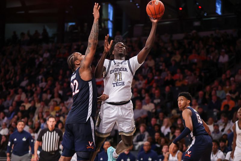 Jan 20, 2024; Atlanta, Georgia, USA; Georgia Tech Yellow Jackets forward Baye Ndongo (11) shoots past Virginia Cavaliers forward Jordan Minor (22) in the second half at McCamish Pavilion. Mandatory Credit: Brett Davis-USA TODAY Sports
