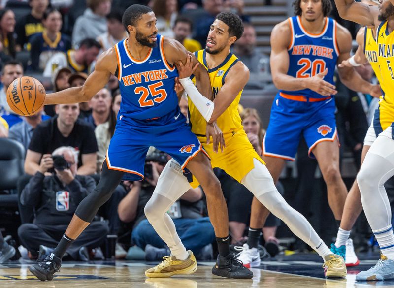 INDIANAPOLIS, INDIANA - NOVEMBER 10: Mikal Bridges #25 of the New York Knicks dribbles the ball and looks to make a play against Tyrese Haliburton #0 of the Indiana Pacers during the second half at Gainbridge Fieldhouse on November 10, 2024 in Indianapolis, Indiana. NOTE TO USER: User expressly acknowledges and agrees that, by downloading and or using this photograph, User is consenting to the terms and conditions of the Getty Images License Agreement. (Photo by Michael Hickey/Getty Images)