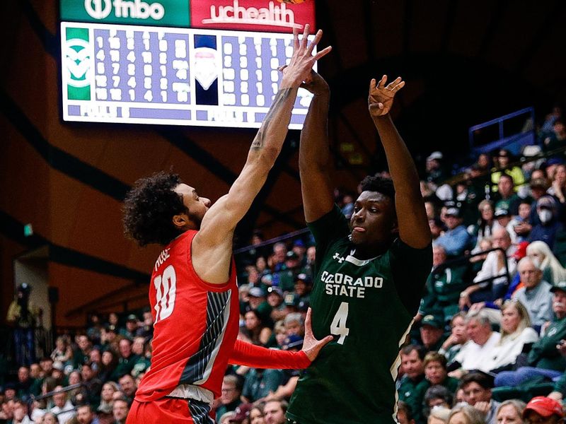 Mar 3, 2023; Fort Collins, Colorado, USA; Colorado State Rams guard Isaiah Stevens (4) passes the ball under pressure from New Mexico Lobos guard Jaelen House (10) in the second half at Moby Arena. Mandatory Credit: Isaiah J. Downing-USA TODAY Sports