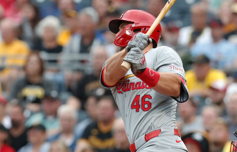 Jul 22, 2024; Pittsburgh, Pennsylvania, USA;  St. Louis Cardinals first baseman Paul Goldschmidt (46) hits a single against the Pittsburgh Pirates during the second inning at PNC Park. Mandatory Credit: Charles LeClaire-USA TODAY Sports