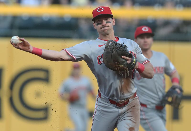 May 19, 2025; Pittsburgh, Pennsylvania, USA;  Cincinnati Reds first baseman Spencer Steer (7) throws to first base to record an out against the Pittsburgh Pirates during the fifth inning at PNC Park. Mandatory Credit: Charles LeClaire-Imagn Images