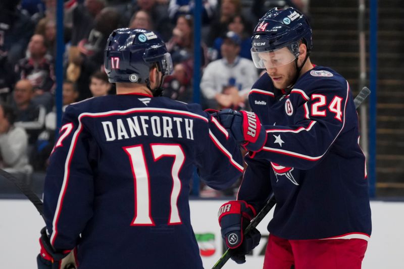 Oct 22, 2024; Columbus, Ohio, USA; Columbus Blue Jackets right wing Mathieu Olivier (24) celebrates with teammates after scoring a goal against the Toronto Maple Leafs during the second period at Nationwide Arena. Mandatory Credit: Aaron Doster-Imagn Images