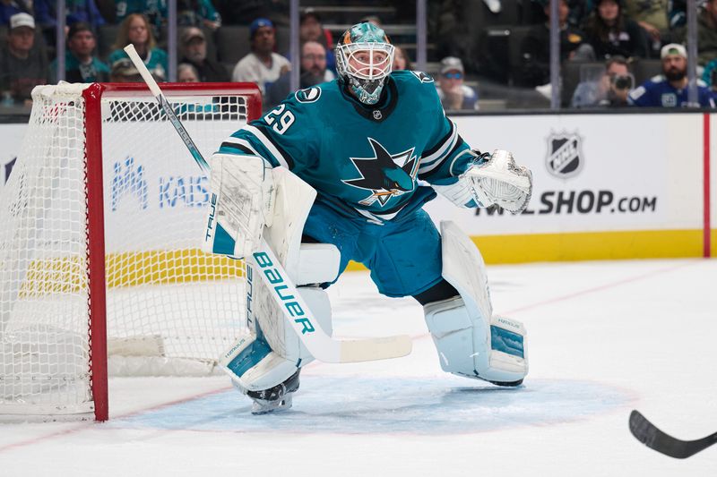 Nov 2, 2024; San Jose, California, USA; San Jose Sharks goaltender Mackenzie Blackwood (29) plays his position against the Vancouver Canucks during the first period at SAP Center at San Jose. Mandatory Credit: Robert Edwards-Imagn Images