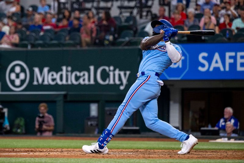 Sep 3, 2023; Arlington, Texas, USA; Texas Rangers right fielder Adolis Garcia (53) hits a walk off home run for the win over the Minnesota Twins during the ninth inning at Globe Life Field. Mandatory Credit: Jerome Miron-USA TODAY Sports