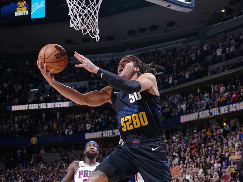 DENVER, CO - JANUARY 27: Aaron Gordon #50 of the Denver Nuggets drives to the basket during the game against the Philadelphia 76ers on January 27, 2024 at the Ball Arena in Denver, Colorado. NOTE TO USER: User expressly acknowledges and agrees that, by downloading and/or using this Photograph, user is consenting to the terms and conditions of the Getty Images License Agreement. Mandatory Copyright Notice: Copyright 2024 NBAE (Photo by Garrett Ellwood/NBAE via Getty Images)