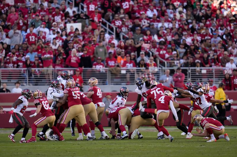 San Francisco 49ers place kicker Jake Moody (4) kicks a point after try during the second half of an NFL football game against the Tampa Bay Buccaneers in Santa Clara, Calif., Sunday, Nov. 19, 2023. (AP Photo/Godofredo A. Vásquez)