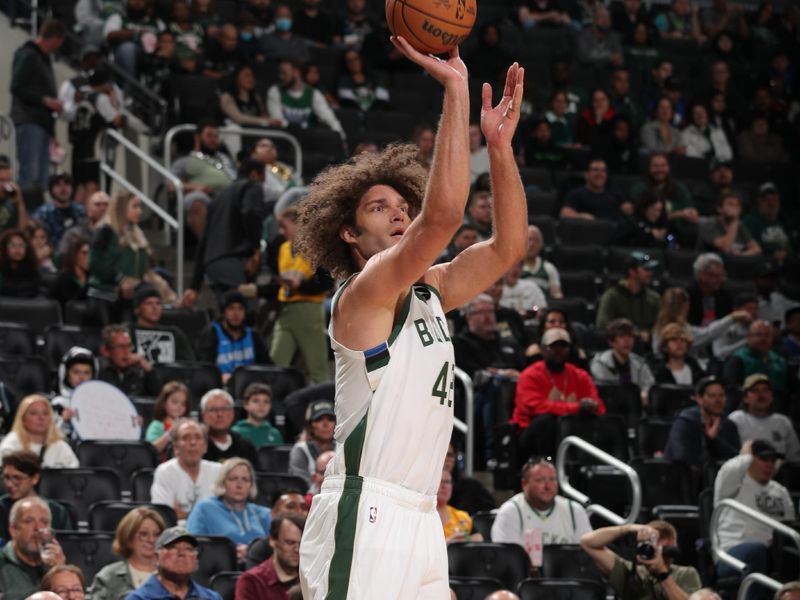 MILWAUKEE, WI - OCTOBER 20: Robin Lopez #42 of the Milwaukee Bucks shoots a three point basket during the preseason game on October 20, 2023 at the Fiserv Forum Center in Milwaukee, Wisconsin. NOTE TO USER: User expressly acknowledges and agrees that, by downloading and or using this Photograph, user is consenting to the terms and conditions of the Getty Images License Agreement. Mandatory Copyright Notice: Copyright 2023 NBAE (Photo by Gary Dineen/NBAE via Getty Images).