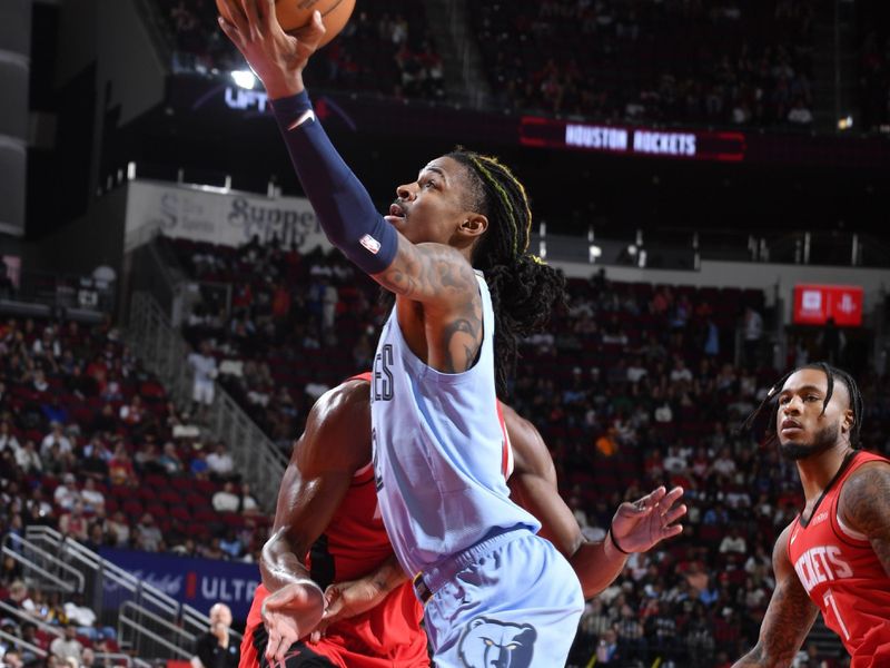 HOUSTON, TX - OCTOBER 25: Ja Morant #12 of the Memphis Grizzlies drives to the basket during the game against the Houston Rockets on October 25, 2024 at the Toyota Center in Houston, Texas. NOTE TO USER: User expressly acknowledges and agrees that, by downloading and or using this photograph, User is consenting to the terms and conditions of the Getty Images License Agreement. Mandatory Copyright Notice: Copyright 2024 NBAE (Photo by Logan Riely/NBAE via Getty Images)