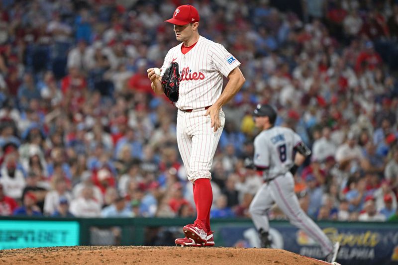 Sep 23, 2025; Philadelphia, Pennsylvania, USA; Philadelphia Phillies pitcher David Robertson (30) reacts after allowing a home run to Miami Marlins outfielder Griffin Conine (18) during the eighth inning at Citizens Bank Park. Mandatory Credit: Eric Hartline-Imagn Images