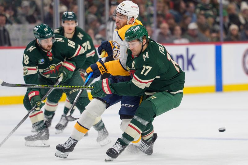 Dec 23, 2025; Saint Paul, Minnesota, USA; Minnesota Wild left wing Marcus Foligno (17) checks Nashville Predators defenseman Adam Wilsby (83) in the third period at Grand Casino Arena. Mandatory Credit: Matt Blewett-Imagn Images